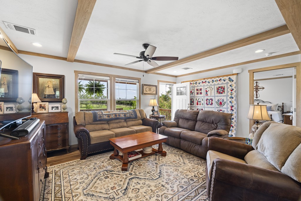 64 Scott Branch Road Harper, TX 78631 - Photo 8 of 36 a living room with furniture ceiling fan and a rug