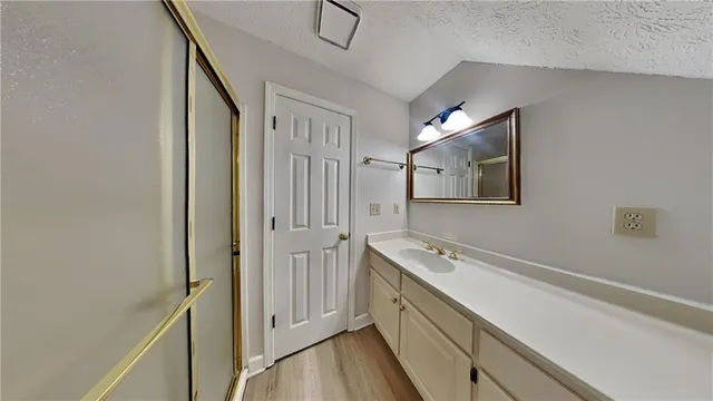 a spacious bathroom with a double vanity sink and a mirror