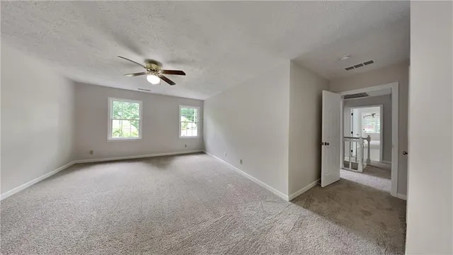 an empty room that has a window in it