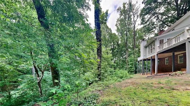 a view of a house with a tree