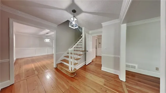 a view of entryway with wooden floor
