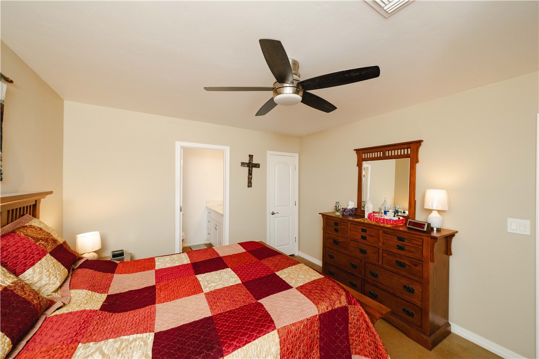 2948 Pinal Road Golden Valley, AZ 86413 - Photo 14 of 59 Spacious room featuring vaulted ceilings, a ceiling fan with integrated lighting, and a neutral wall color