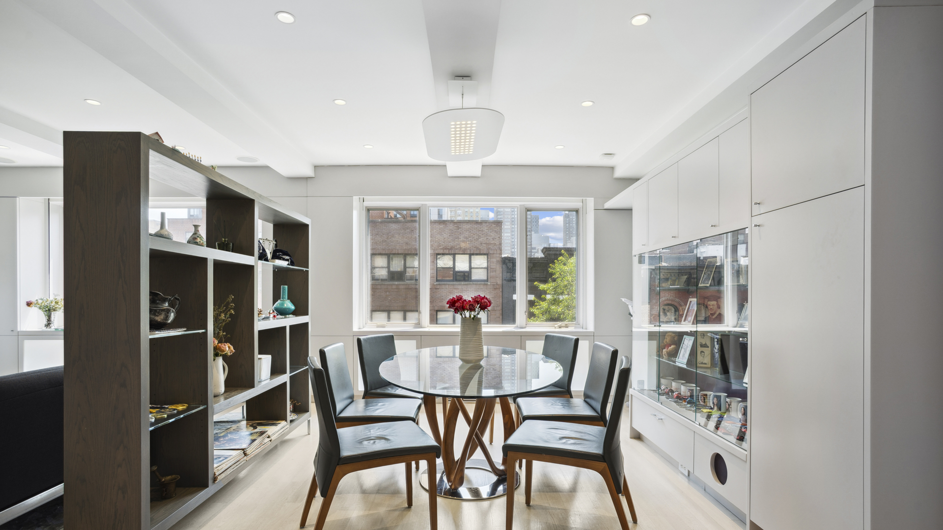 435 East 76th Street, Unit 6A Manhattan, NY 10021 - Photo 3 of 13 a view of a dining room with furniture window and wooden floor
