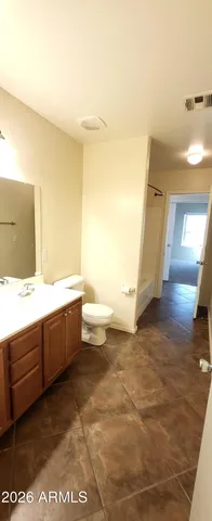 a bathroom with a sink a toilet and a bathtub
