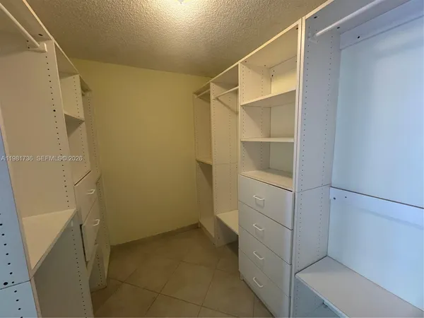 a view of an empty walk in closet