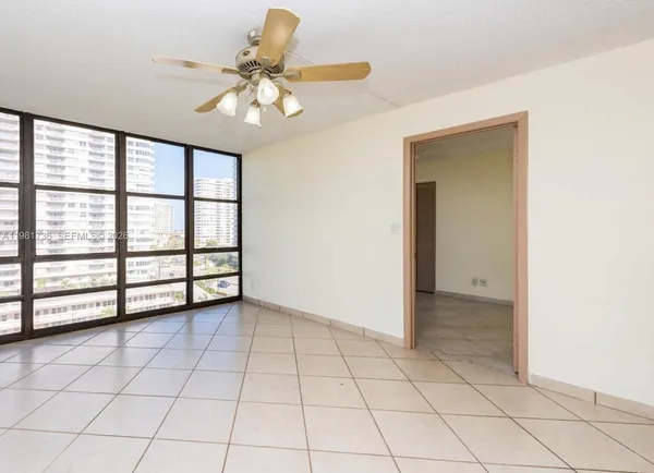 a view of an empty room with a window