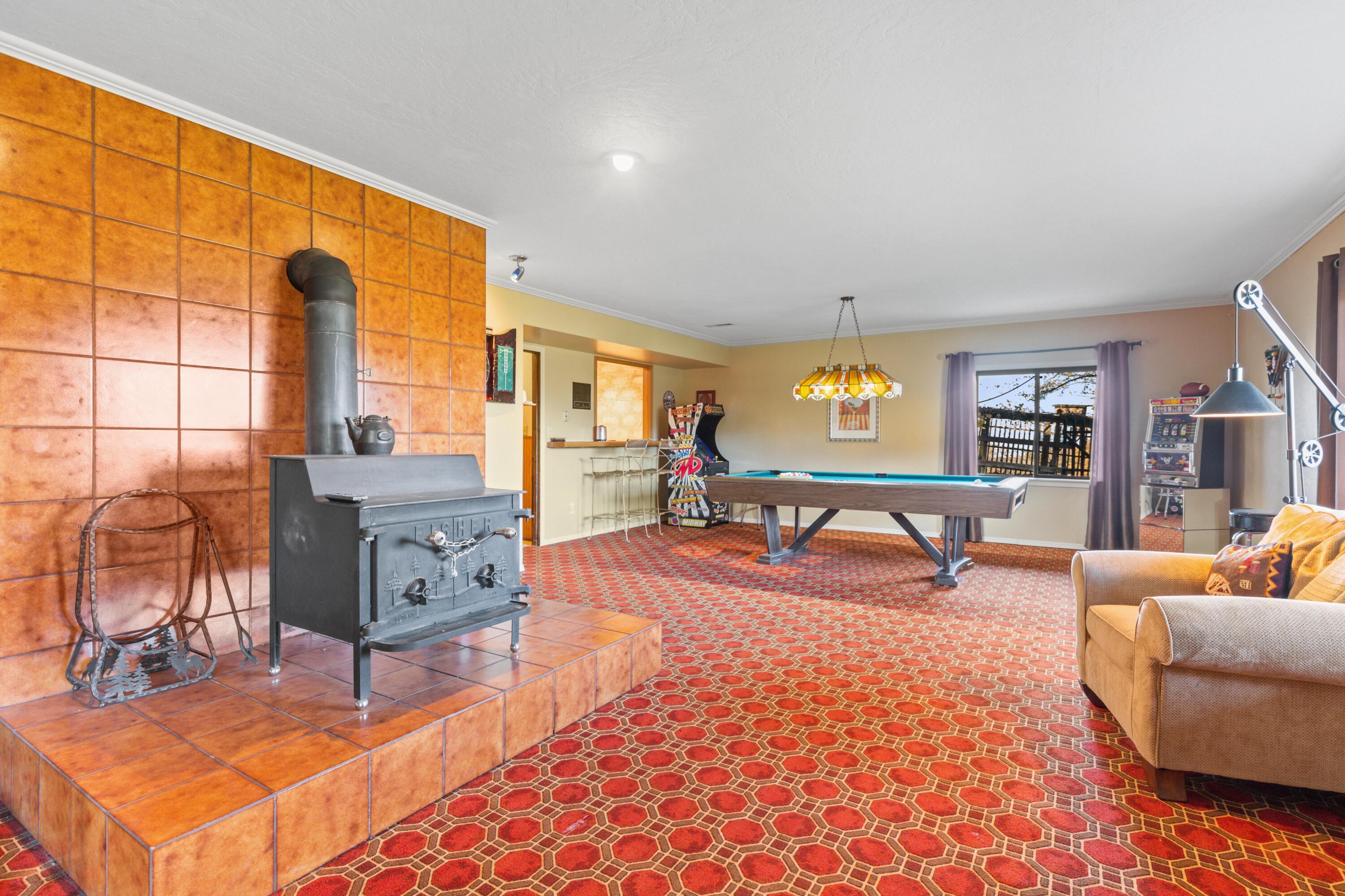 4351 Pioneer Road Medford, OR 97501 - Photo 42 of 55 Downstairs Game Room w/ Fireplace