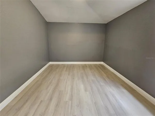 a white toilet sitting next to a bath tub