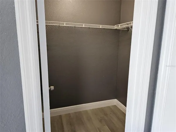 a kitchen with a refrigerator and a stove