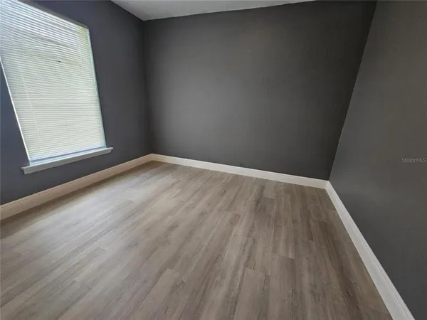 a bathroom with a sink a toilet and shower curtain