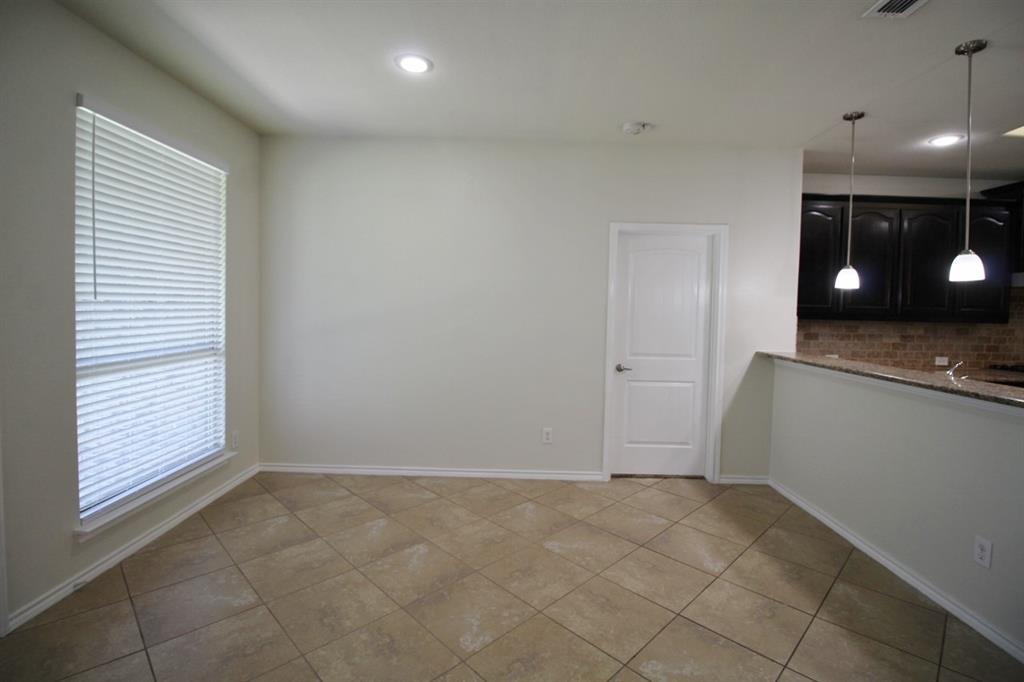 1205 Crest Ridge Drive Glenn Heights, TX 75154 - Photo 11 of 27 wooden floor in an empty room and a window