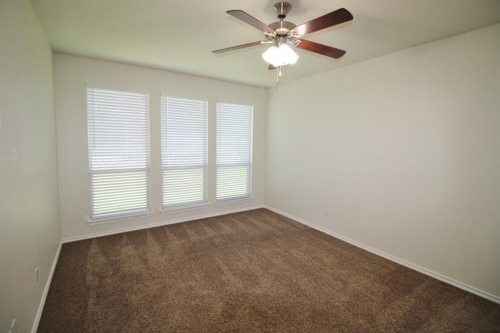 1205 Crest Ridge Drive Glenn Heights, TX 75154 - Photo 13 of 27 an empty room with a window and a fan