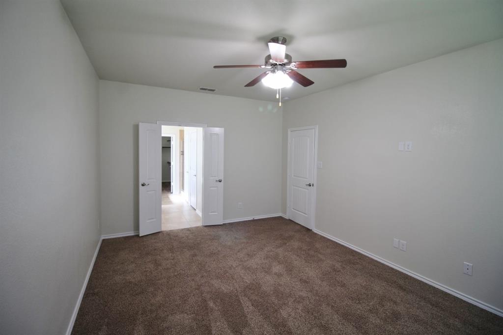 1205 Crest Ridge Drive Glenn Heights, TX 75154 - Photo 14 of 27 en empty room with windows and fan