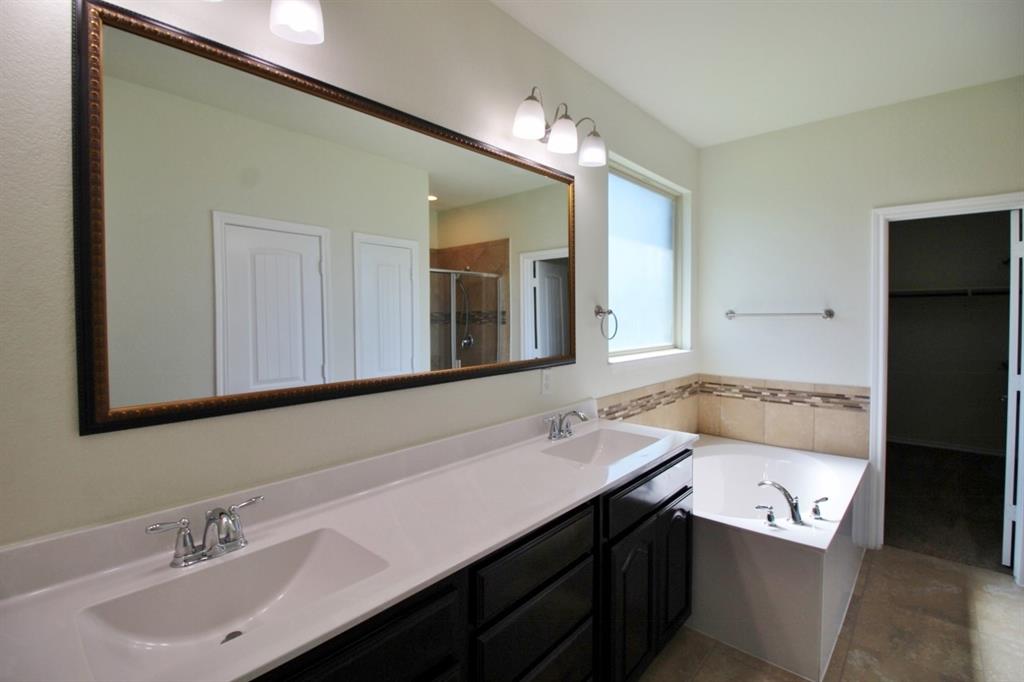 1205 Crest Ridge Drive Glenn Heights, TX 75154 - Photo 15 of 27 a bathroom with a sink double vanity granite and a mirror