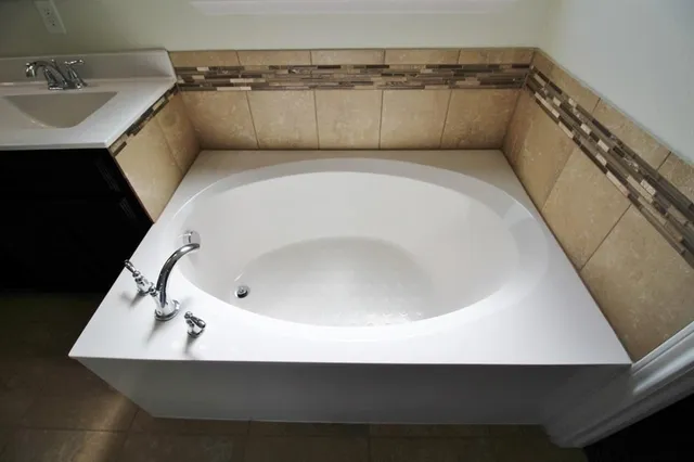 a bathroom with a glass shower door
