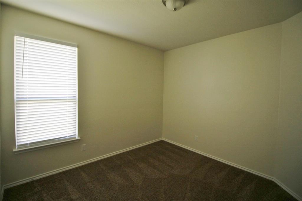 1205 Crest Ridge Drive Glenn Heights, TX 75154 - Photo 19 of 27 a view of a room that has a window in it