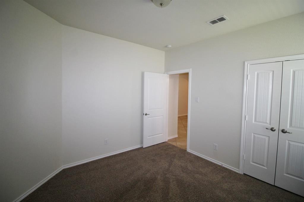 1205 Crest Ridge Drive Glenn Heights, TX 75154 - Photo 20 of 27 an empty room with closet area