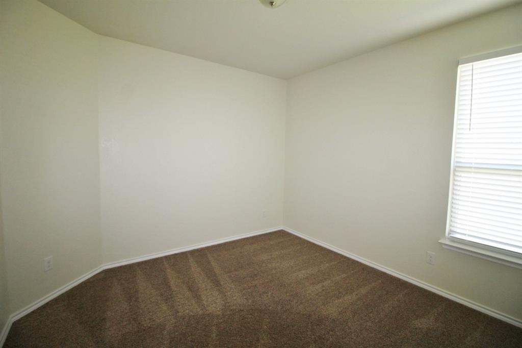 1205 Crest Ridge Drive Glenn Heights, TX 75154 - Photo 21 of 27 an empty room with a window