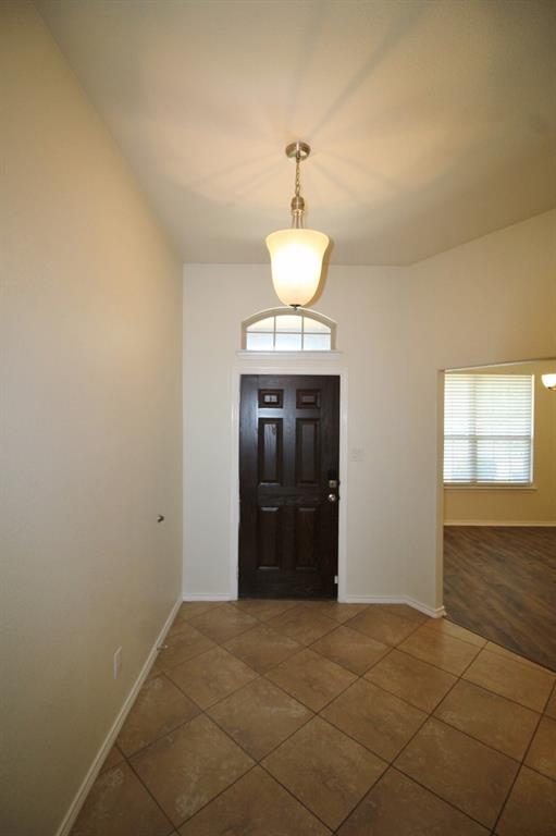 1205 Crest Ridge Drive Glenn Heights, TX 75154 - Photo 3 of 27 a view of a hallway with a chandelier