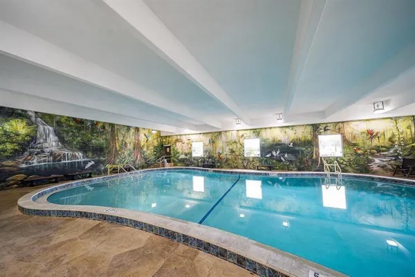 a view of a swimming pool and outdoor space
