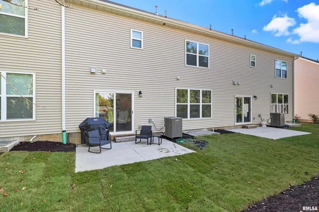 a backyard of a house with seating space