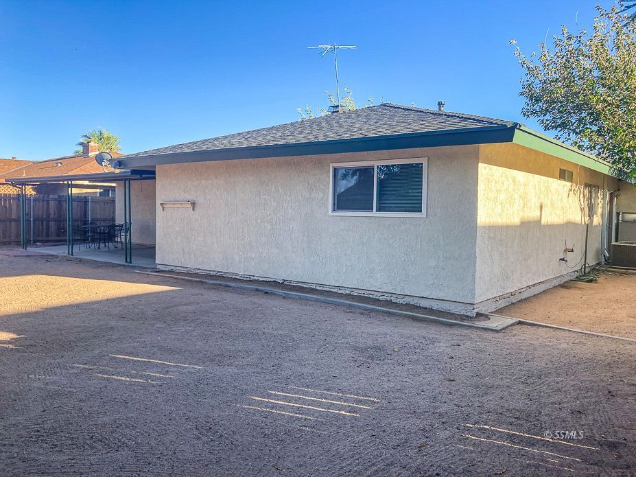 216 West Boston Avenue Ridgecrest, CA 93555 - Photo 32 of 36 a view of a house with backyard and swimming pool