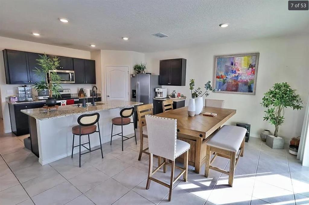 1724 Buckeye Road Davenport, FL 33837 - Photo 3 of 8 a view of a dining room with furniture