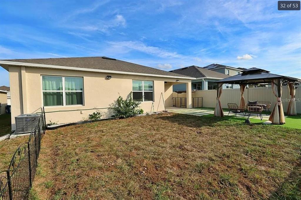 1724 Buckeye Road Davenport, FL 33837 - Photo 6 of 8 a front view of a house with garden