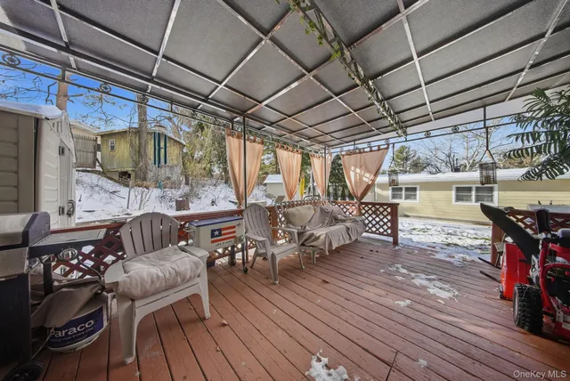 a view of a chairs and table on the deck