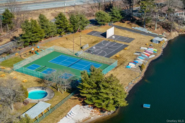a view of a swimming pool with a yard