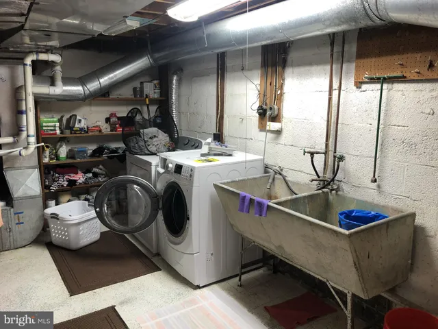 a view of a room with washer and dryer