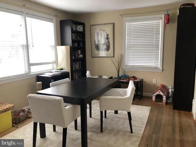 a view of a dining room with furniture and window