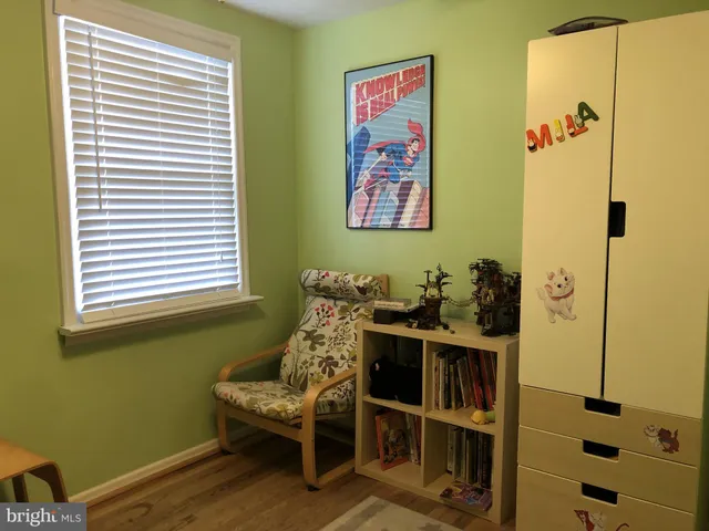 a view of a room with furniture and window