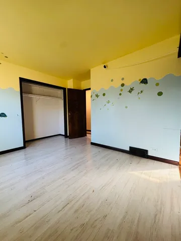 a view of a big room with wooden floor