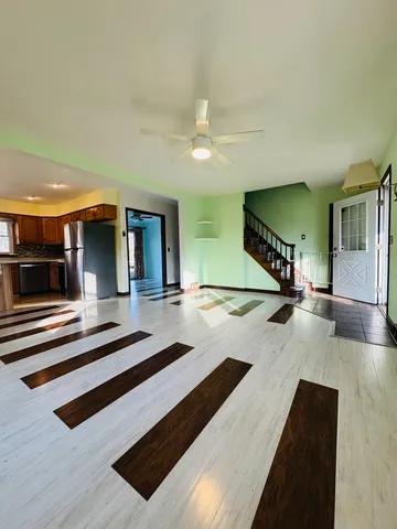 a view of lobby with furniture and a rug