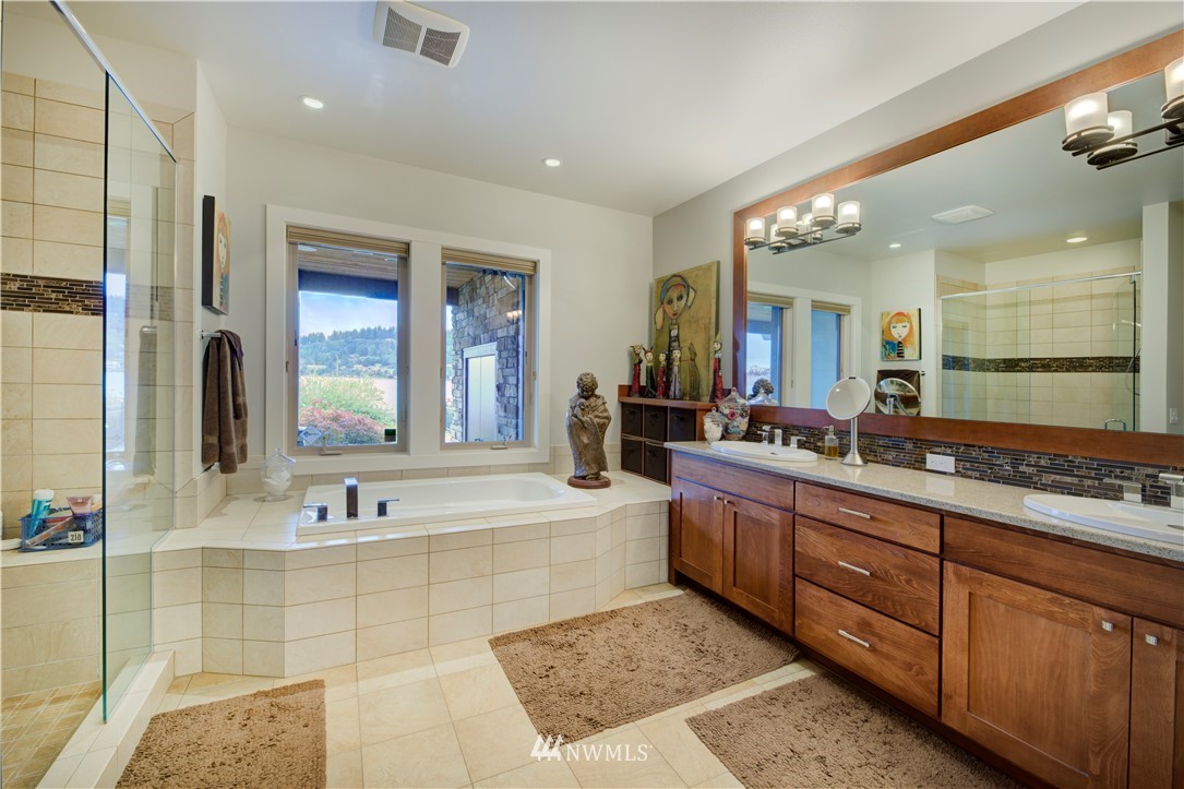4169 Williams Avenue North Renton, WA 98056 - Photo 14 of 35 a spacious bathroom with a tub sink and mirror