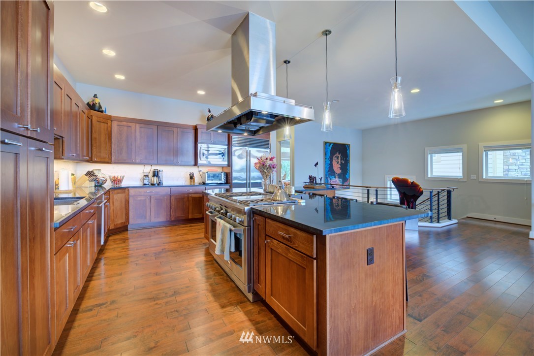 4169 Williams Avenue North Renton, WA 98056 - Photo 5 of 35 a kitchen with stainless steel appliances granite countertop a stove and a refrigerator