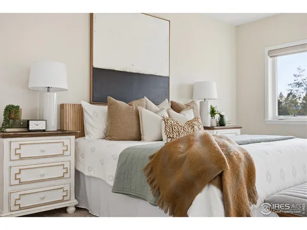 a bedroom with a bed and a fireplace