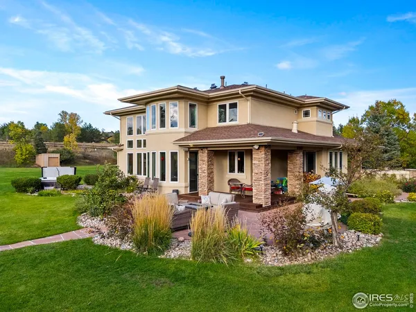 a front view of a house with garden and porch