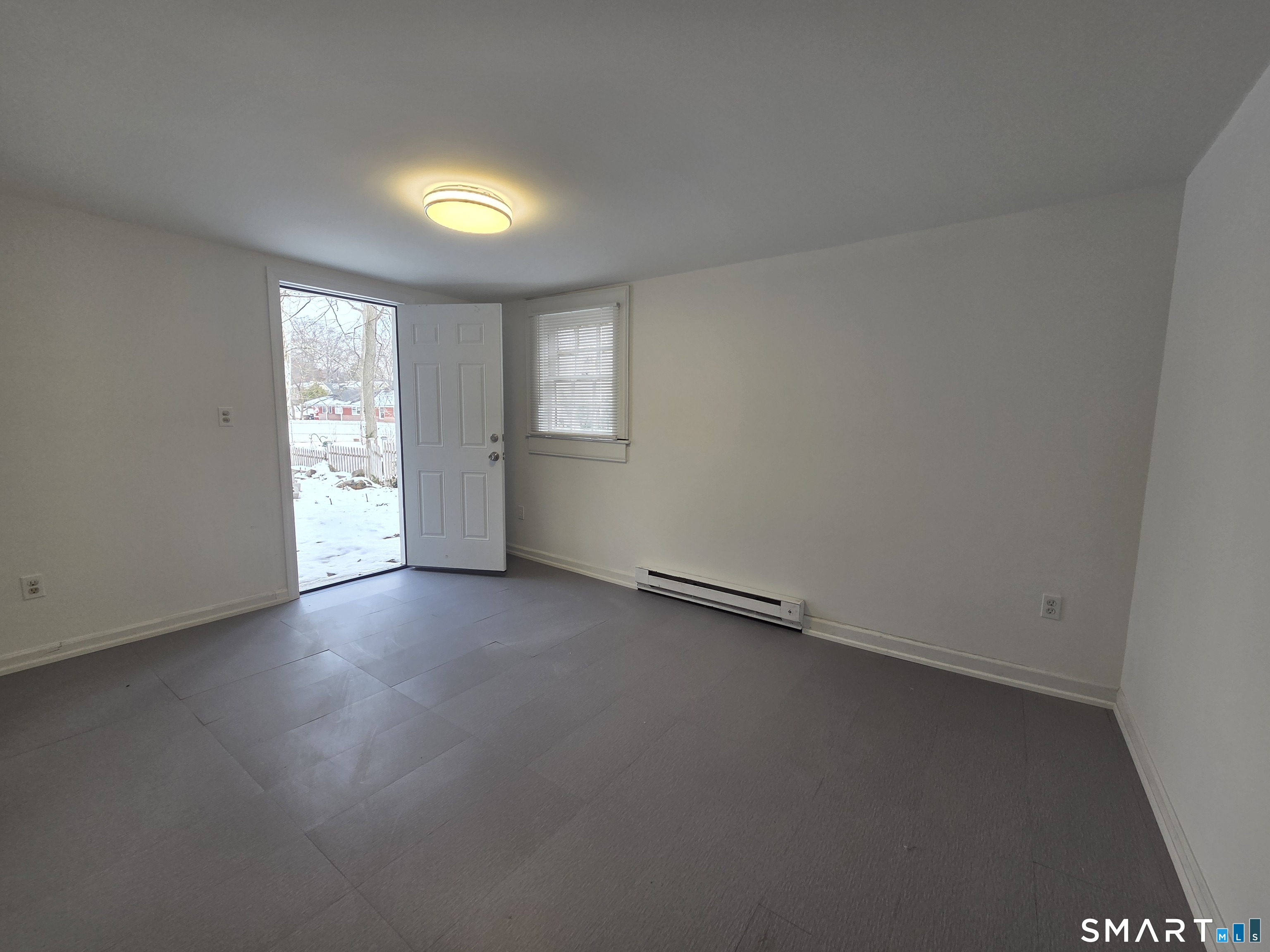 55 Glendale Road Stamford, CT 06905 - Photo 22 of 25 Lower Level bonus room leads to back lawn