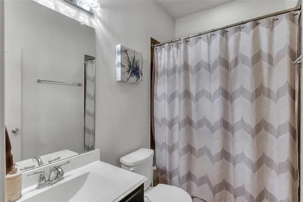 a bathroom with a sink and toilet