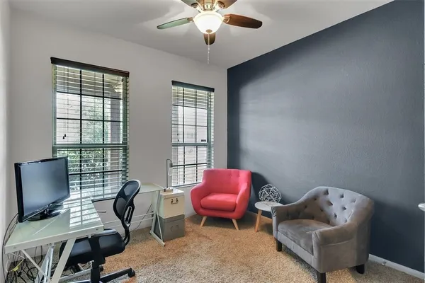 a workspace with furniture and a window