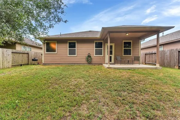 a front view of house with yard and seating area