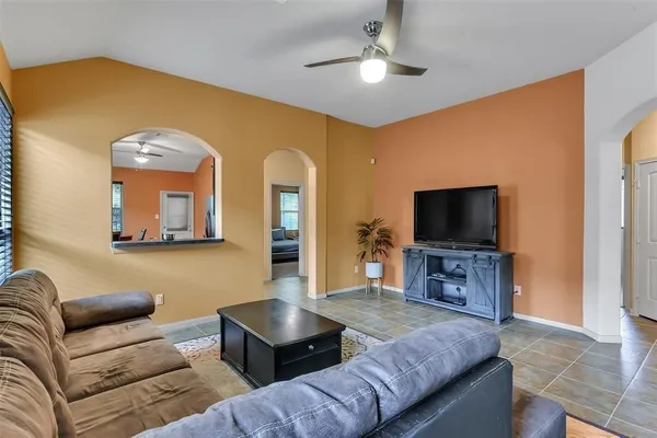 a living room with furniture and a flat screen tv