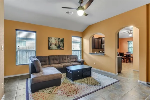 a living room with furniture and a window