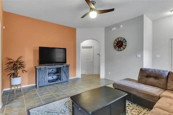 a living room with furniture and a flat screen tv