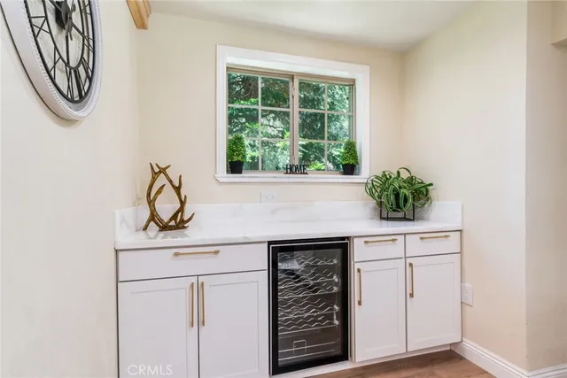 a kitchen with white cabinets and a stove