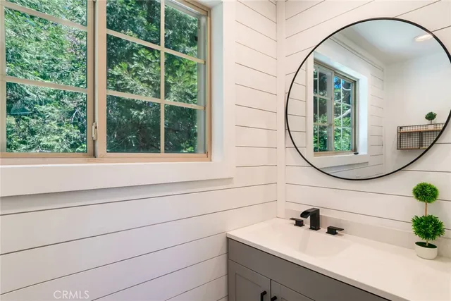 a bathroom with a sink and a mirror