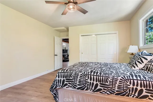 a bedroom with a bed and window