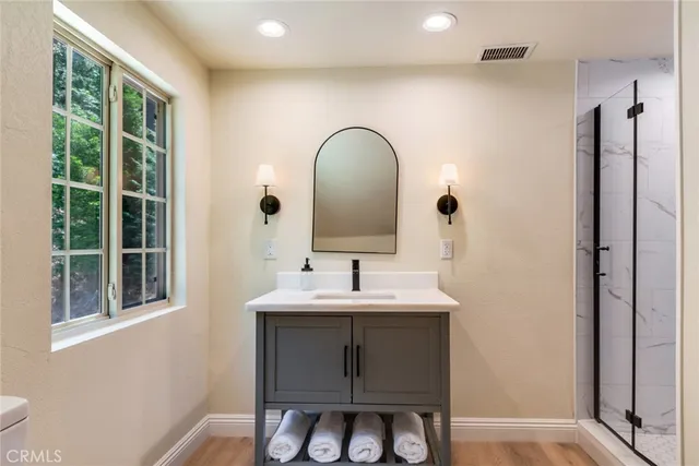 a bathroom with a sink and a mirror